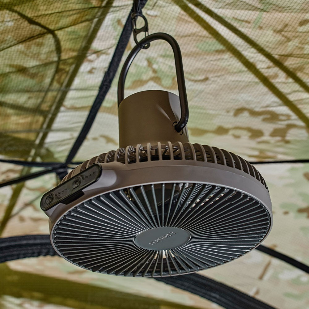 Black V1040 fan hanging inside a tent by its folding handle