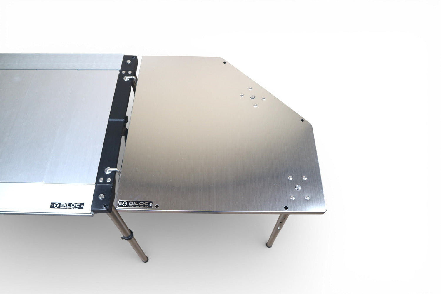 Silver Biloc corner table joined to an IGT table, showing the bare hairline finish. The host table is a separate purchase.