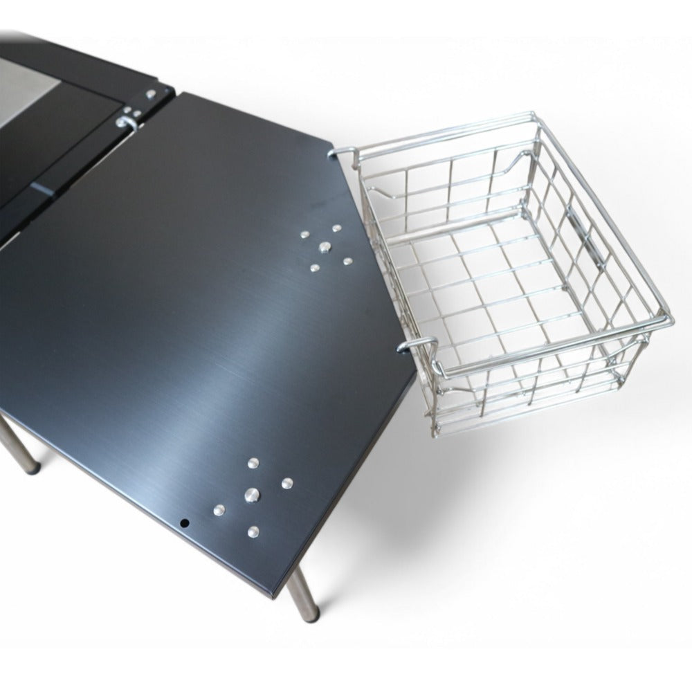 Wire basket hanging from the corner table's IGT side holes. The basket is a separate purchase.