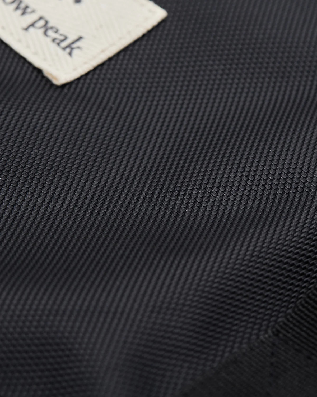 Close-up of the mesh fabric panel on the Fireplace Bag L