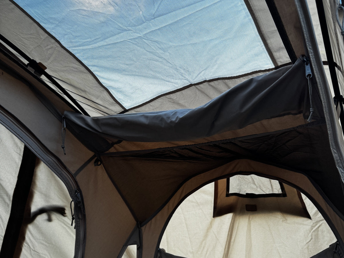 Looking up inside the tent at daylight through the rainfly roof window (tent sold separately).