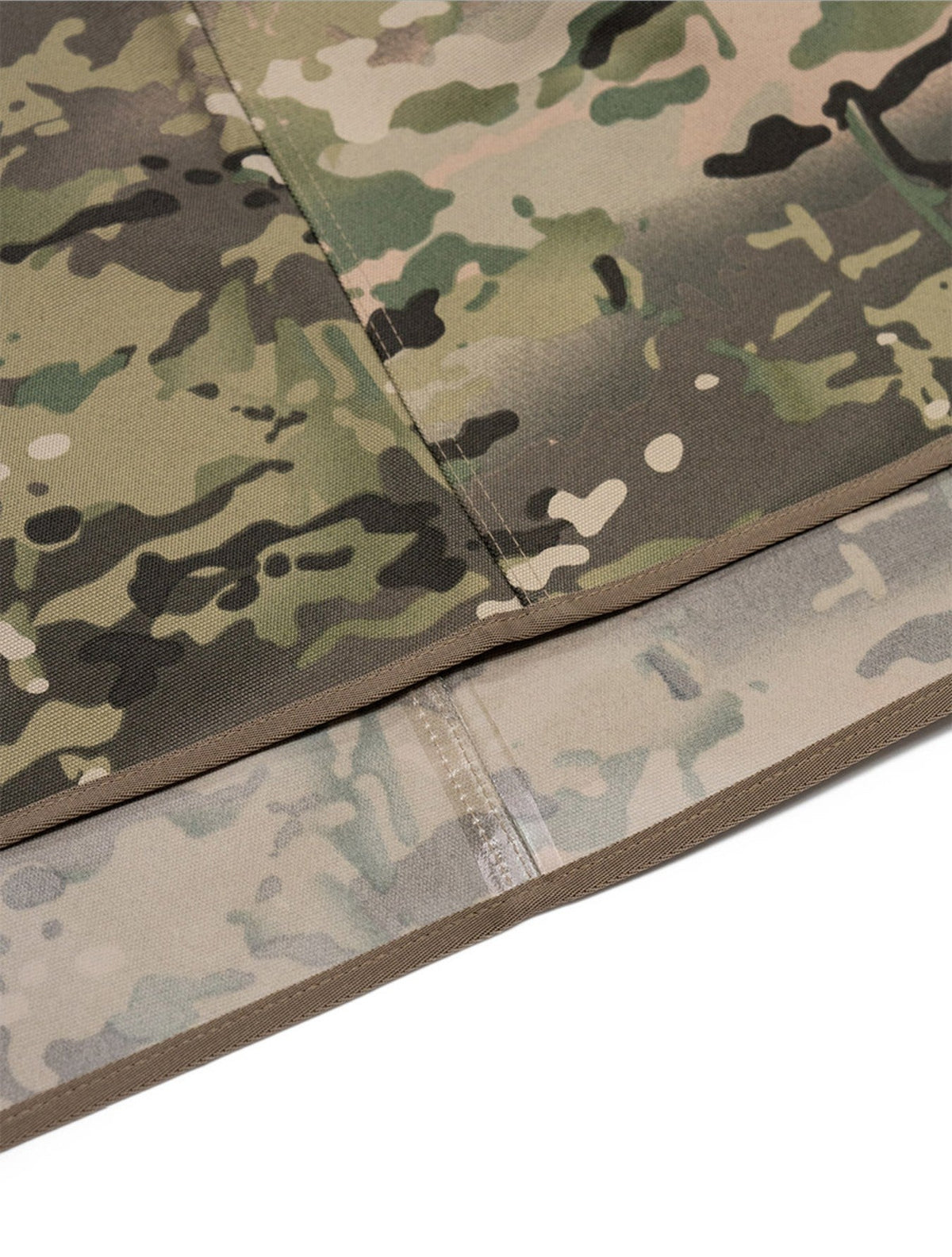 Multicam sheet folded back to show the coated underside and sealed seam