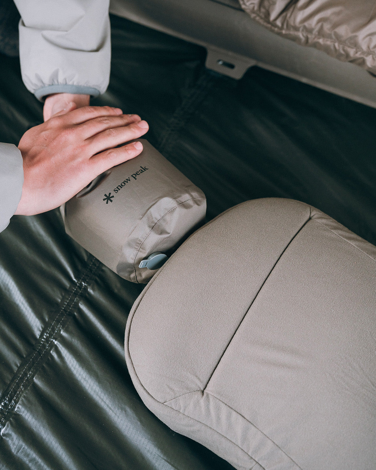 Air Pillow, being inflated on a camp mat