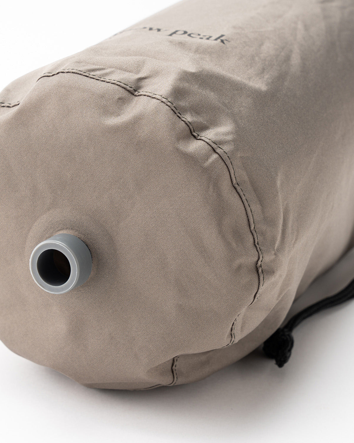 Air Pillow, the storage bag inflating the pillow through its nozzle