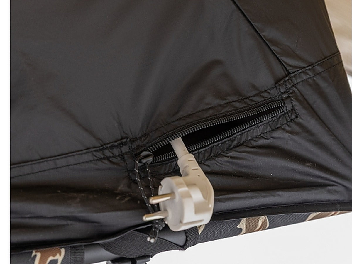 Power cord routed through the cord slot in the tent wall