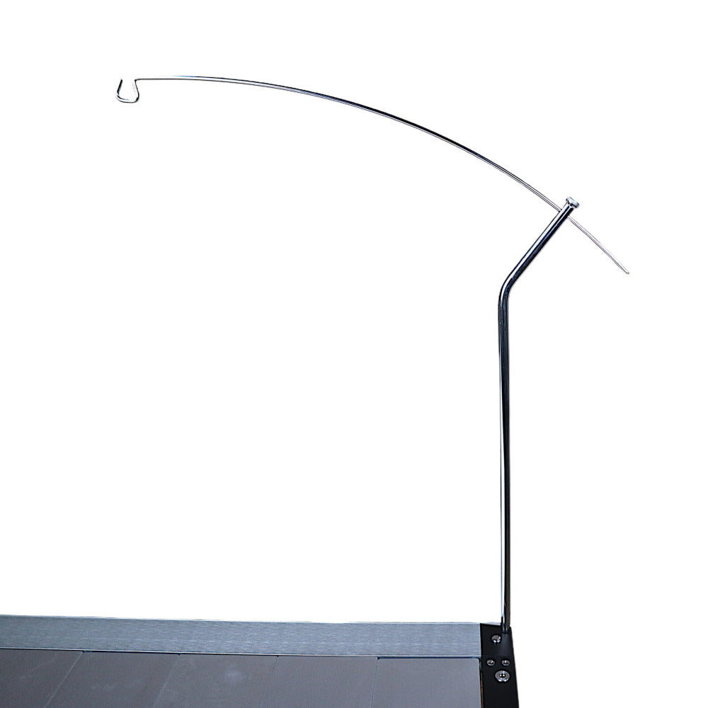 Biloc IGT Lantern Hanger mounted on a camp table, arm reaching out over the table top.