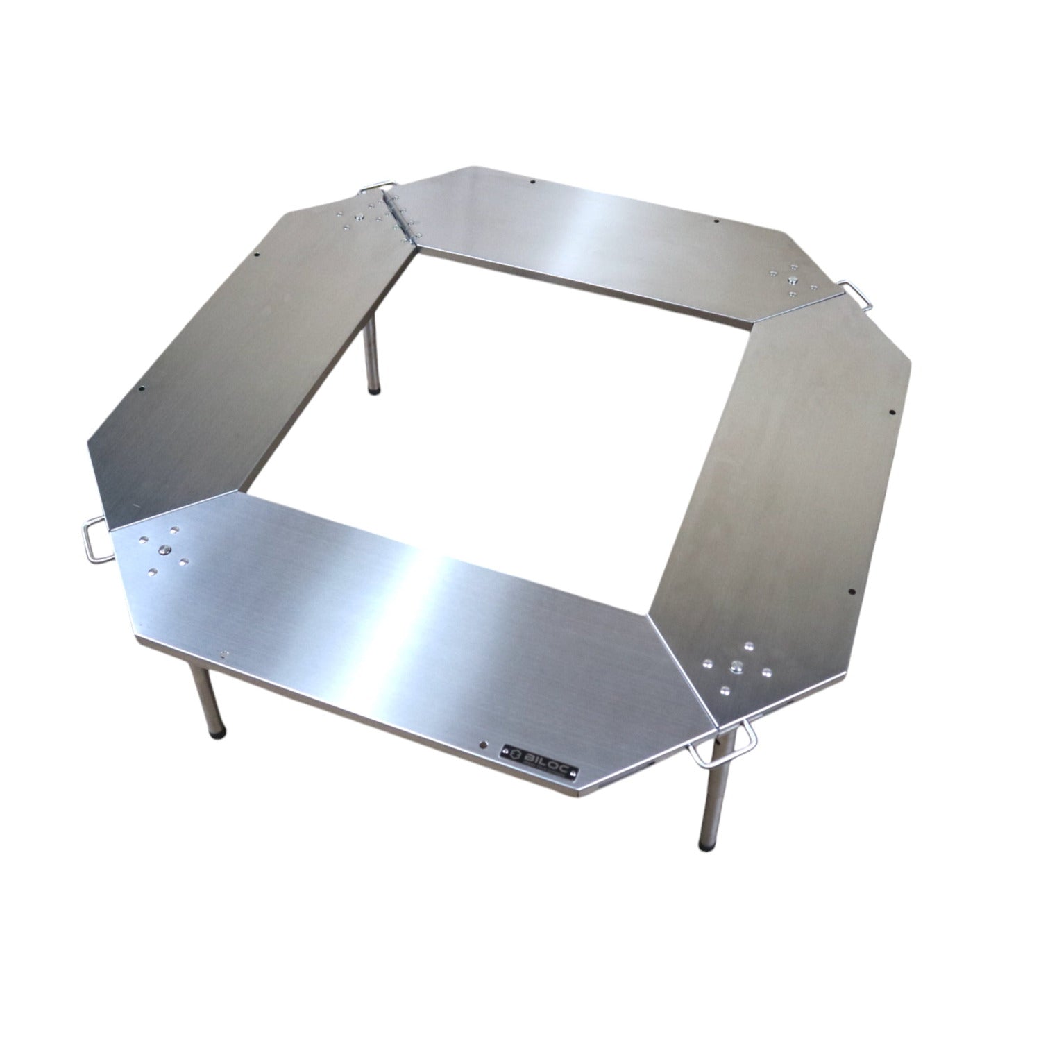 Biloc Octa IGT fire ring table in brushed stainless steel, octagonal open-centre design on folding legs