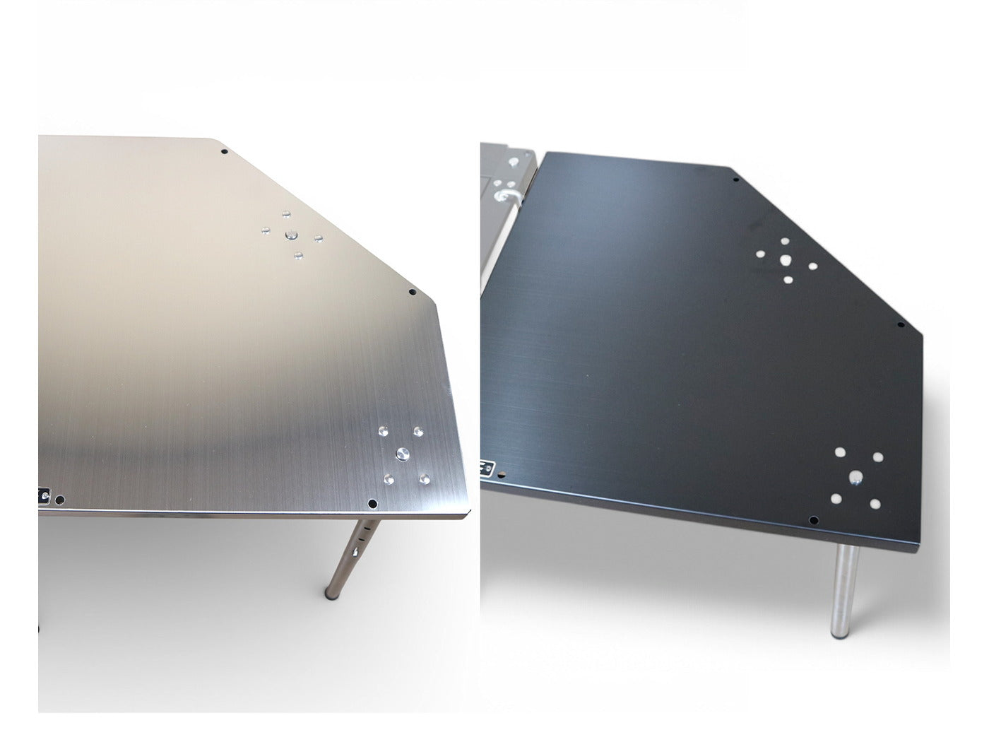 Corner table tops in both finishes side by side: hairline silver stainless and matte black.