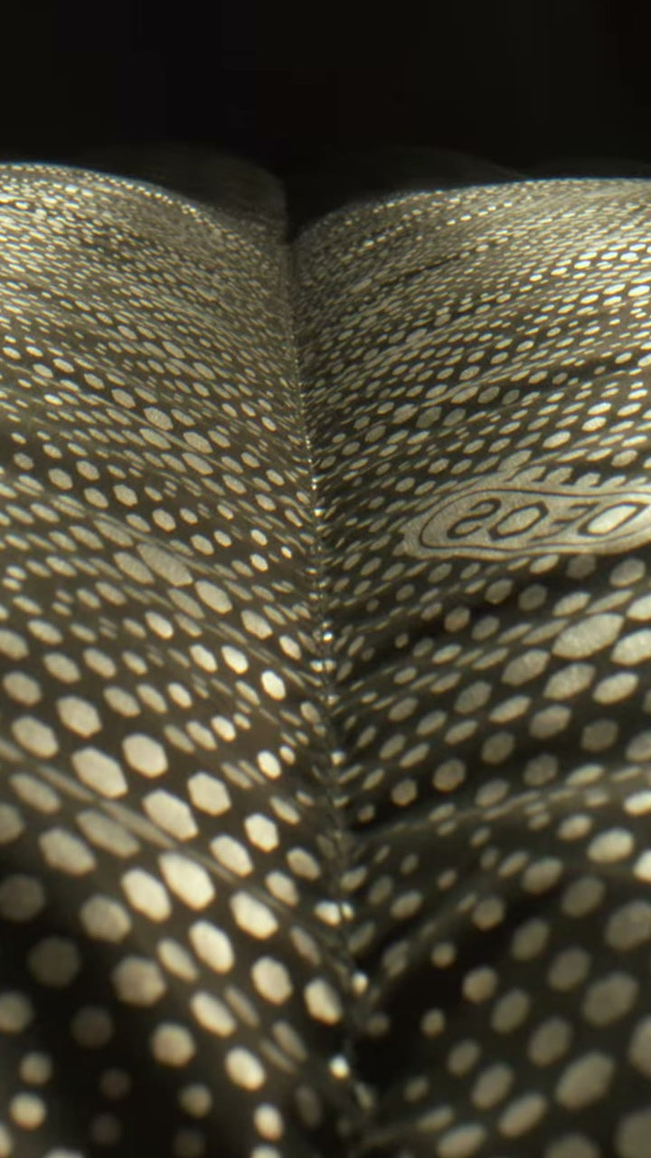 DEOS reflective fabric macro, cinematic