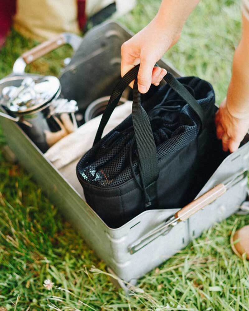 Home & Camp Burner Storage Bag, Black, sitting inside a Shelf Container
