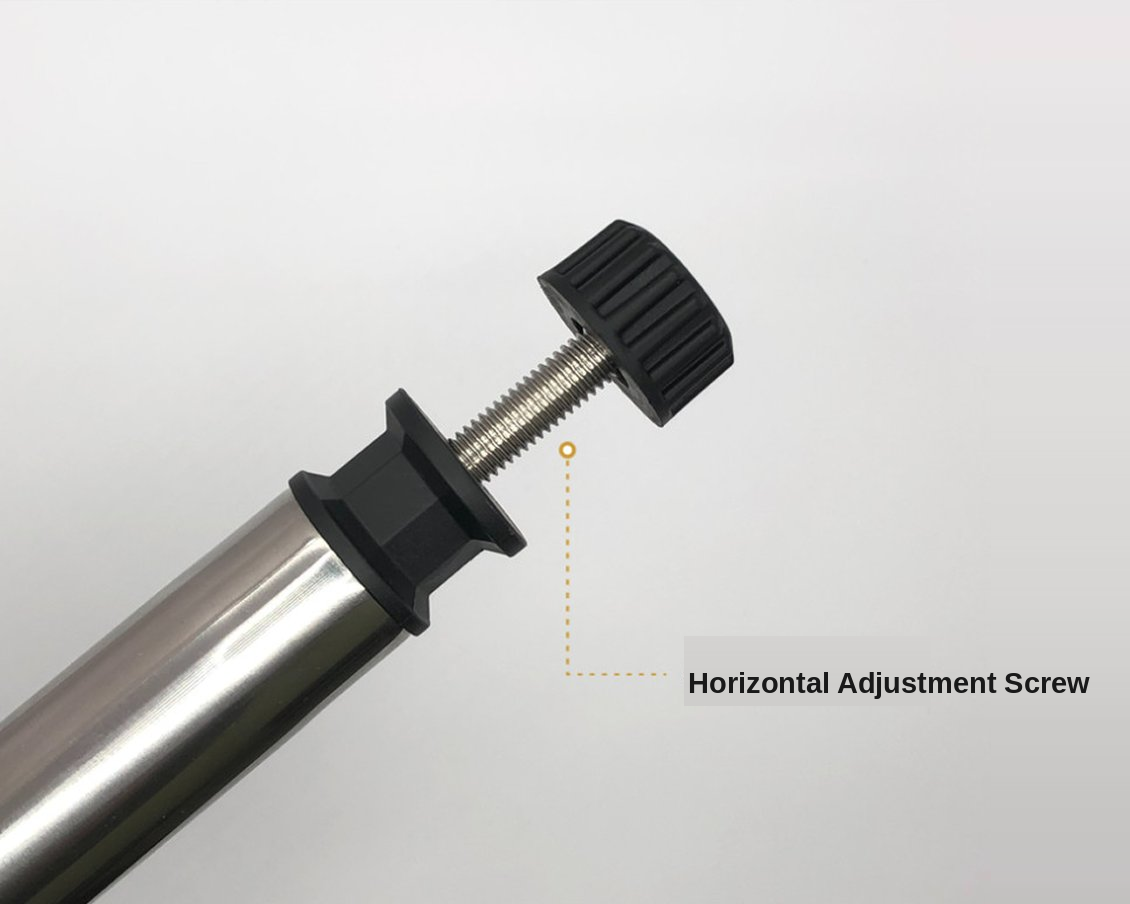 Turning a foot thumb screw to level a loaded camp table