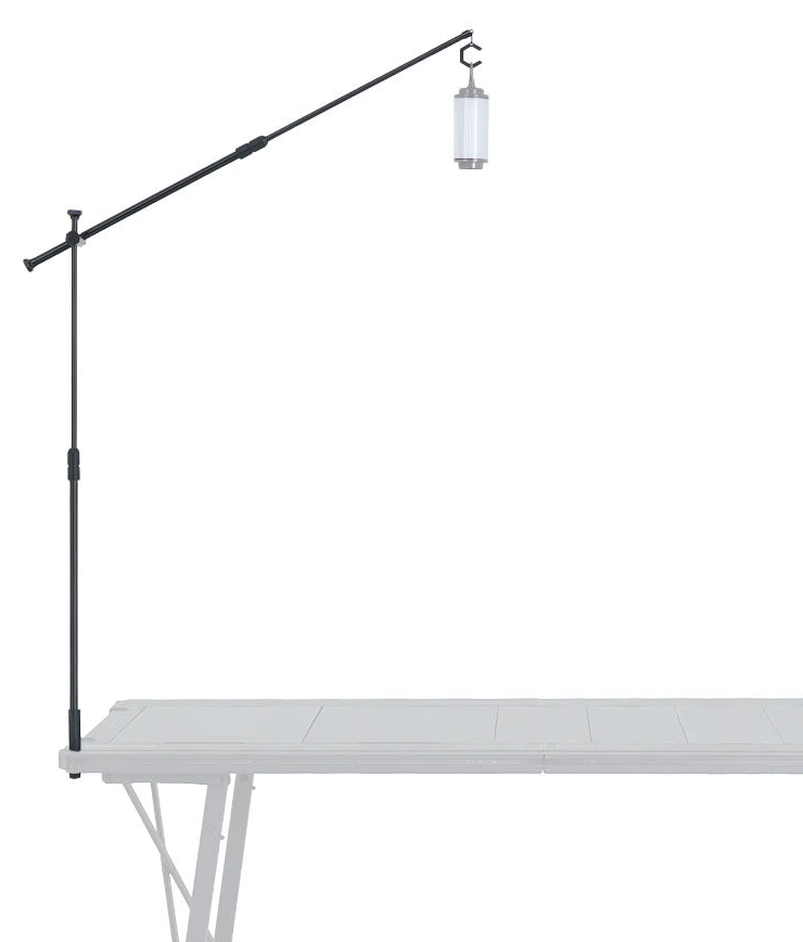 BUENOFE IGT Lantern Hanger viewed at an angle, the two-stage boom arm extended out over a long camping table with a lantern hanging from the C-hook, highlighting the reach and overhead placement of the light on a white background.