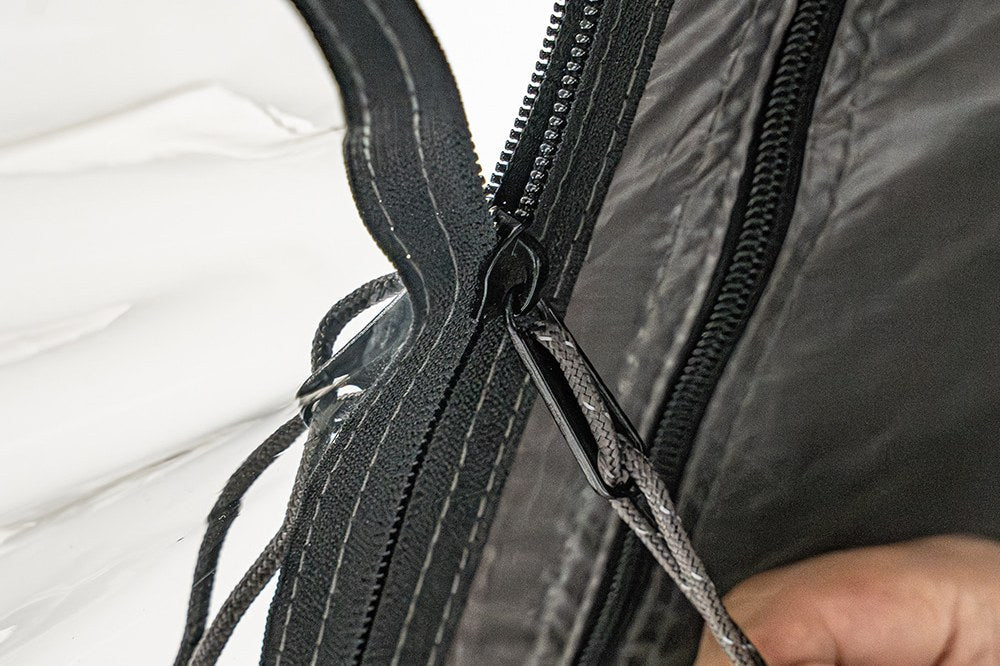 Close-up of zipper-Velcro attachment between panel and tent body