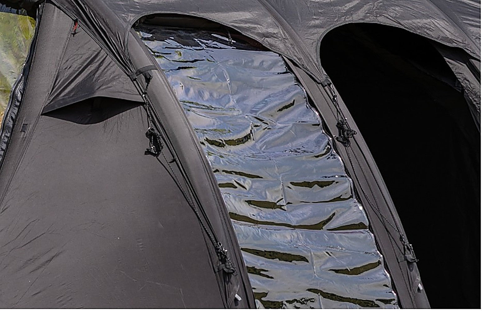Close-up of the Ghost Phantom Air side extension's clear TPU panel glinting between black air-beam arches
