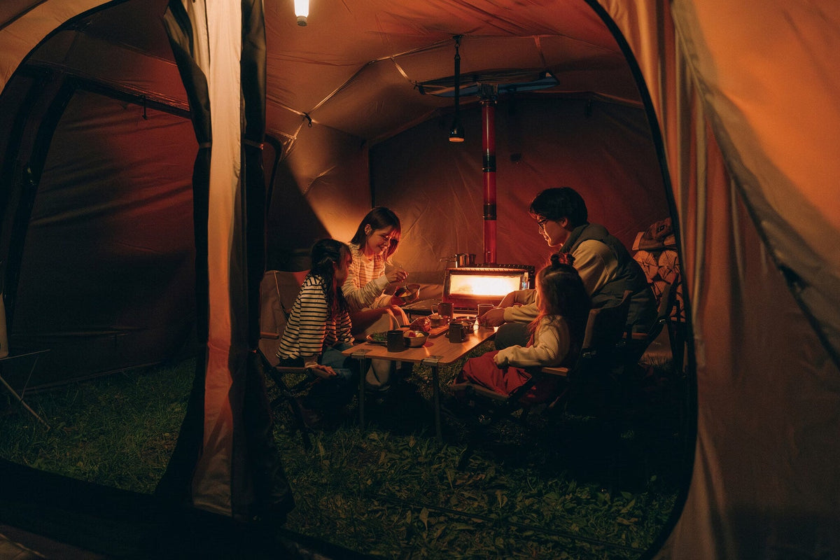 Land Lock X, Brown, a family inside the lit interior at night