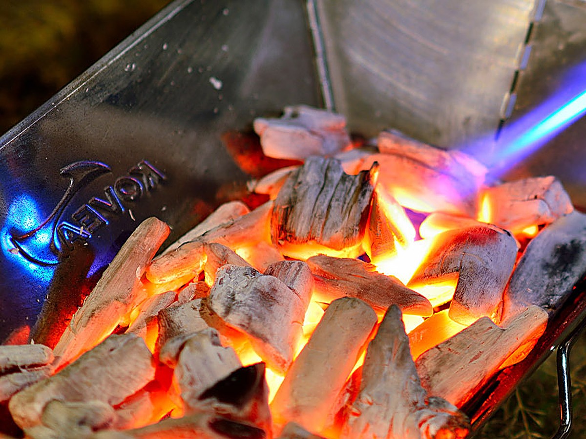 Glowing charcoal in the stainless firebox