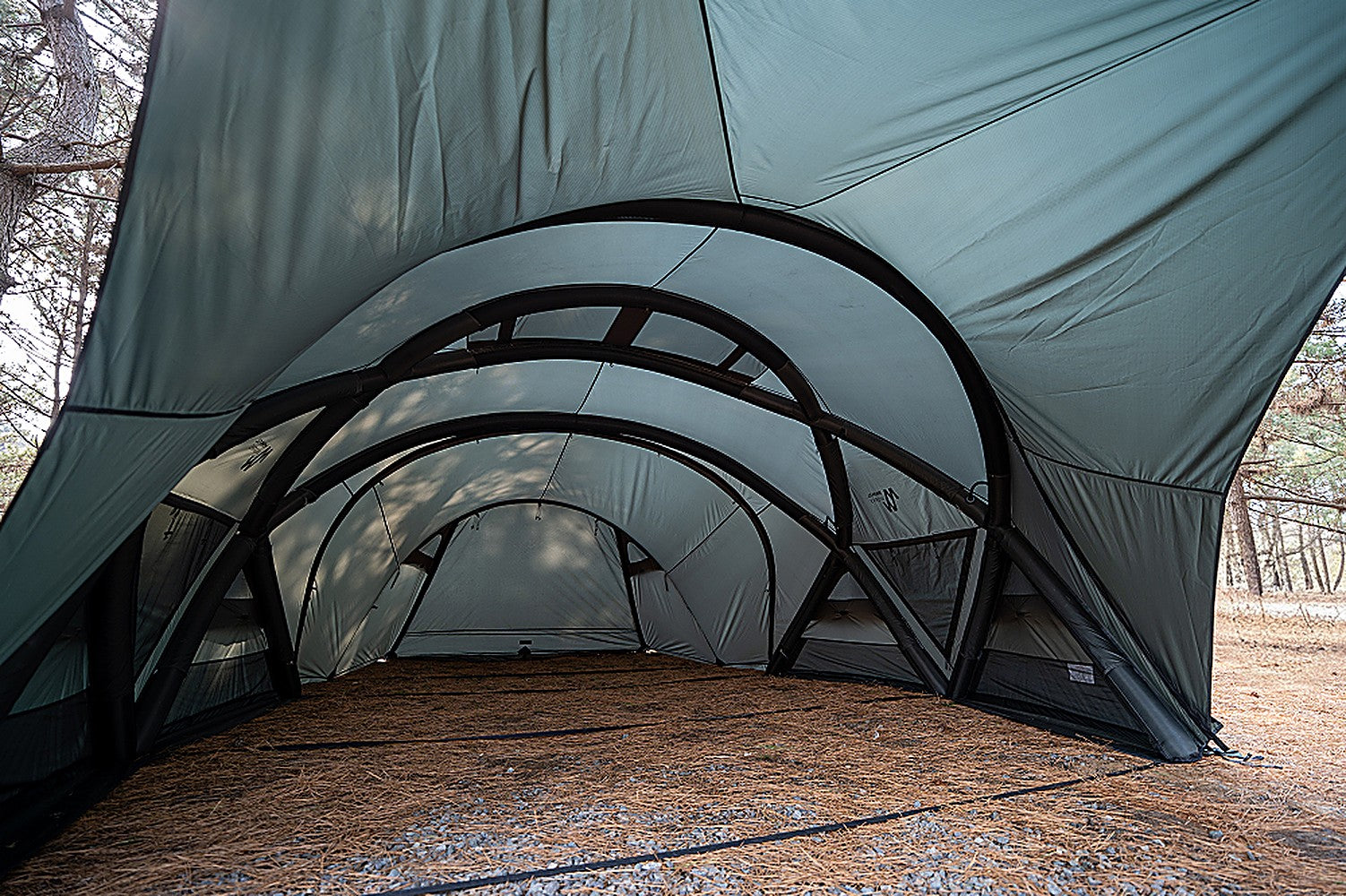 Close interior view of the porch skin and arched frame stretched taut over the covered area
