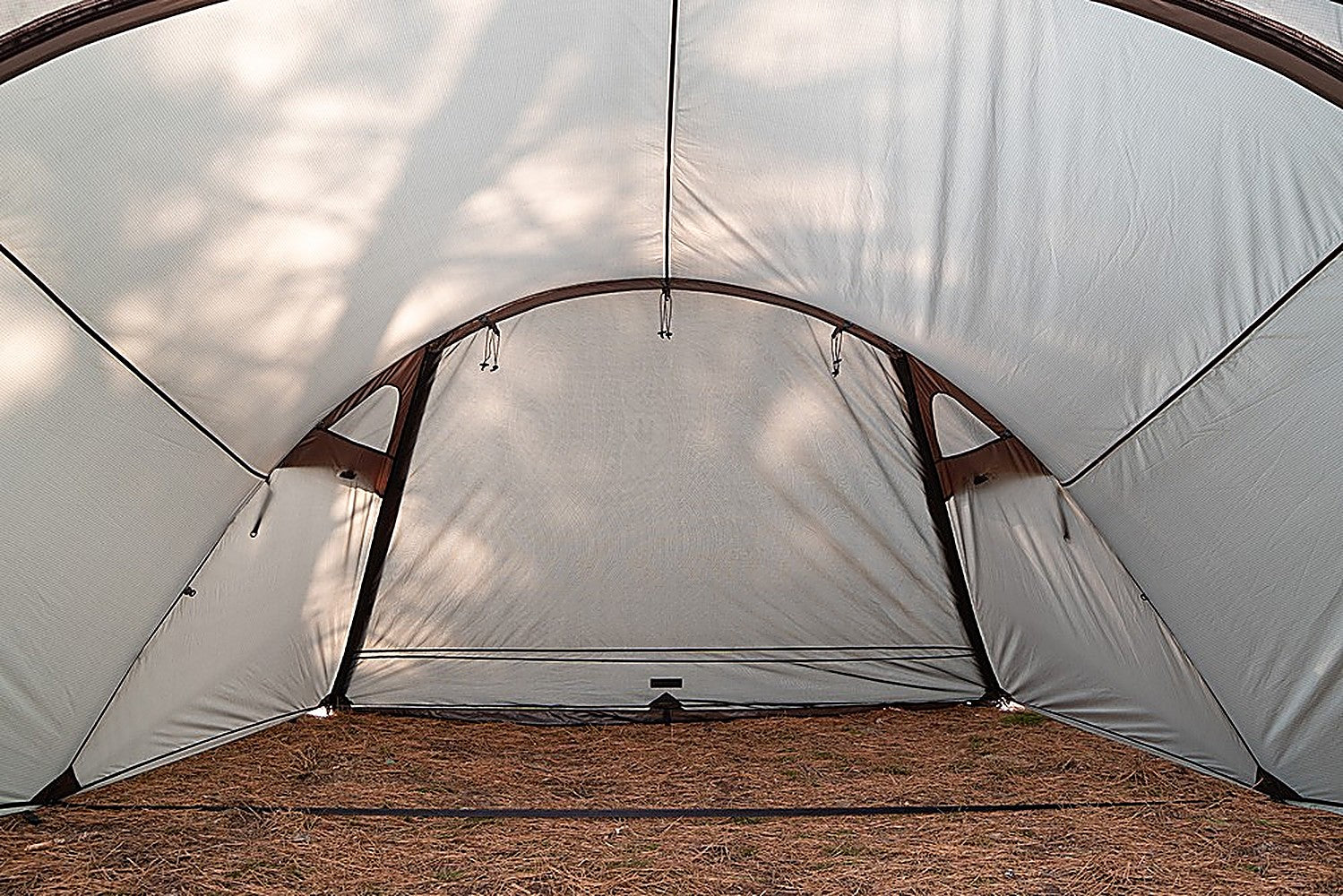 Shelter GM Vestibule interior with closed arched mesh partition and light grey fabric walls