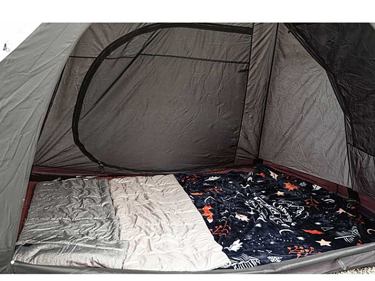 Black inner tent set up with bedding for sleeping