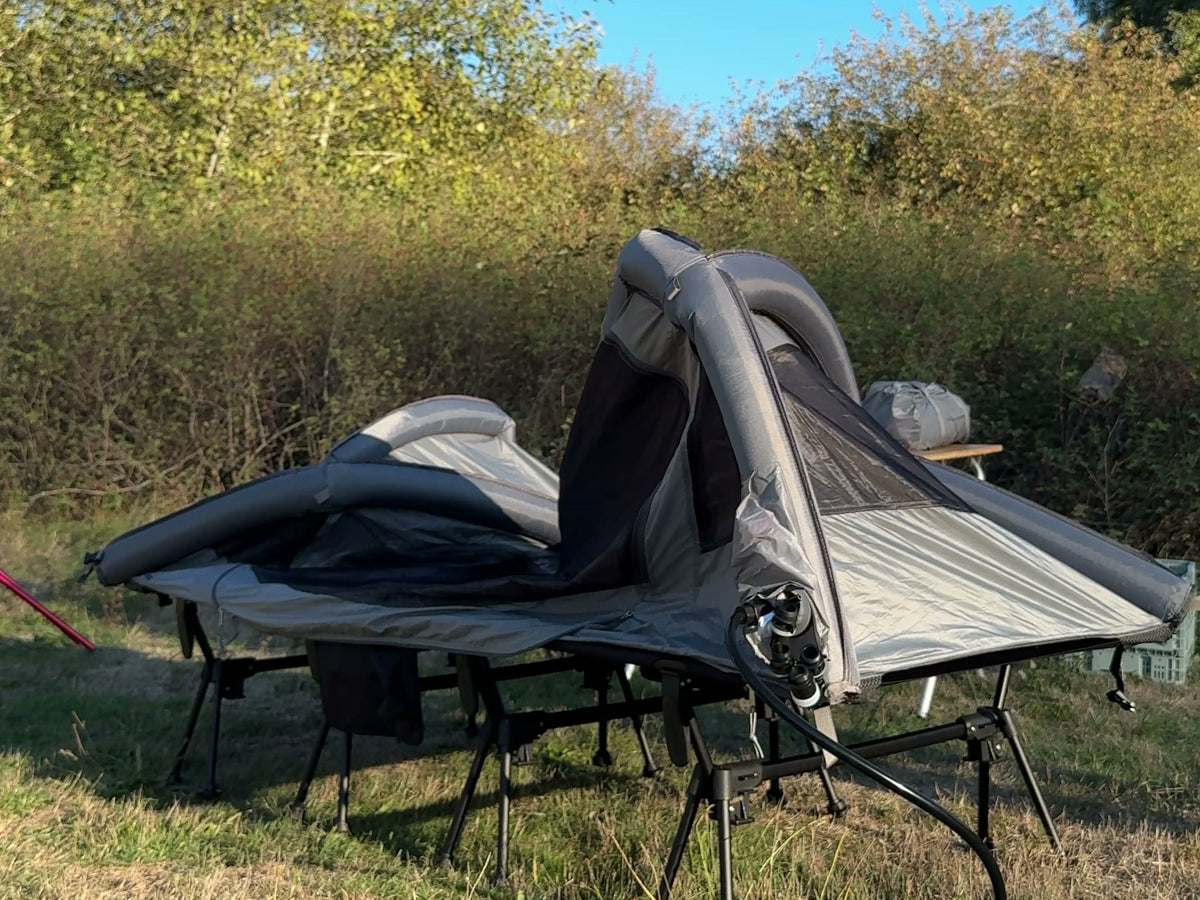 Neo Nest 80 Air half inflated on a camp cot, front beam already standing (cot and electric pump sold separately).