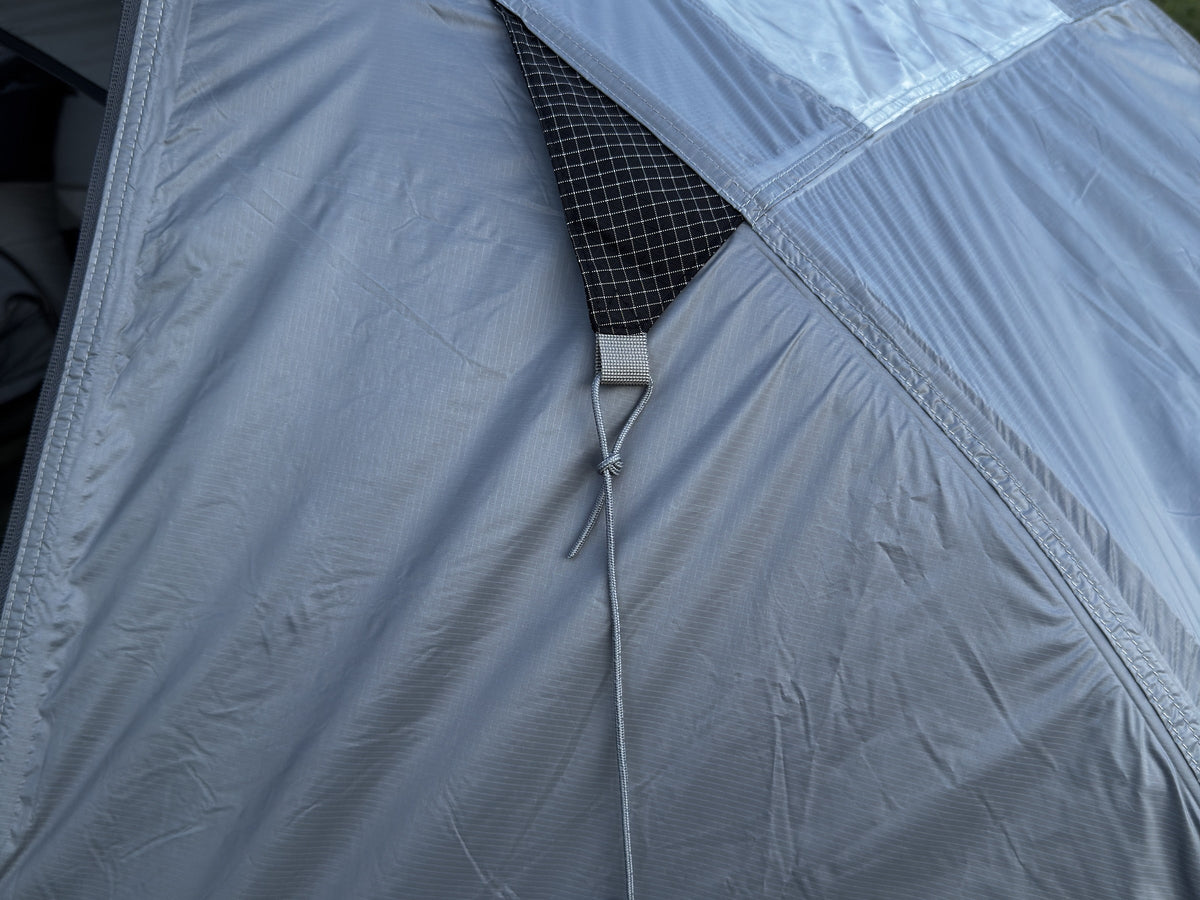 Webbing anchor on the Air rainfly with its pre-attached reflective guy line and hook.
