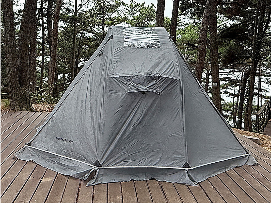 Rainfly fully covering the Neo Nest 80 Air cot tent on a wooden deck, rear view (tent and cot sold separately).