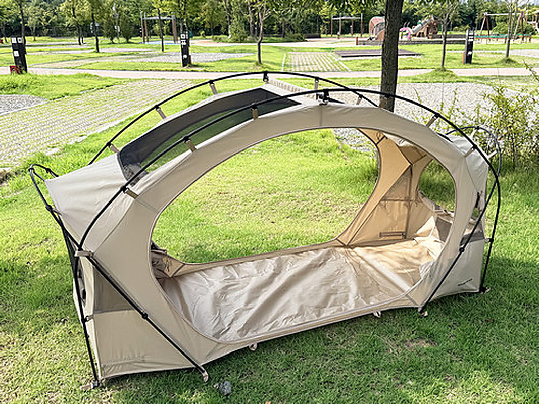 Neo Nest 80 pitched directly on grass in ground mode with both doors open, no cot in use.