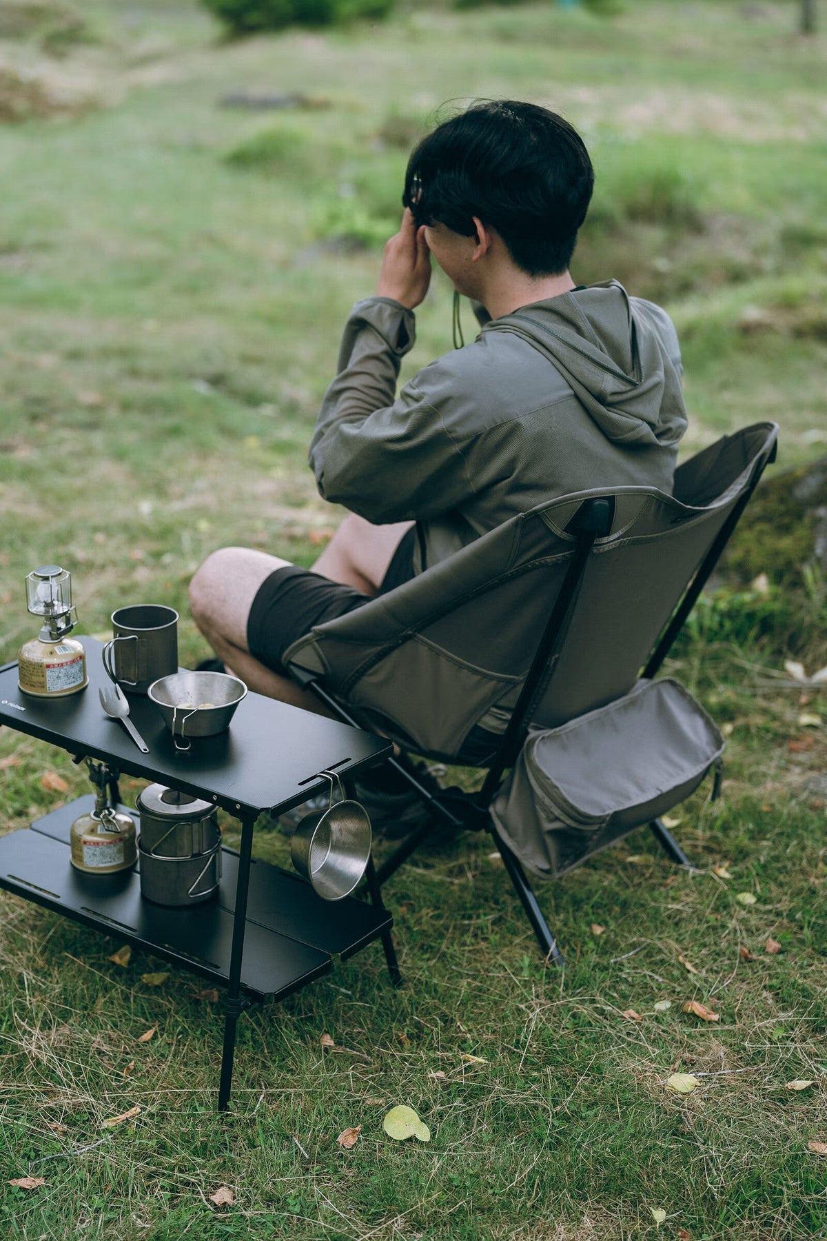 Noga Chair, Greige, in use at a camp table
