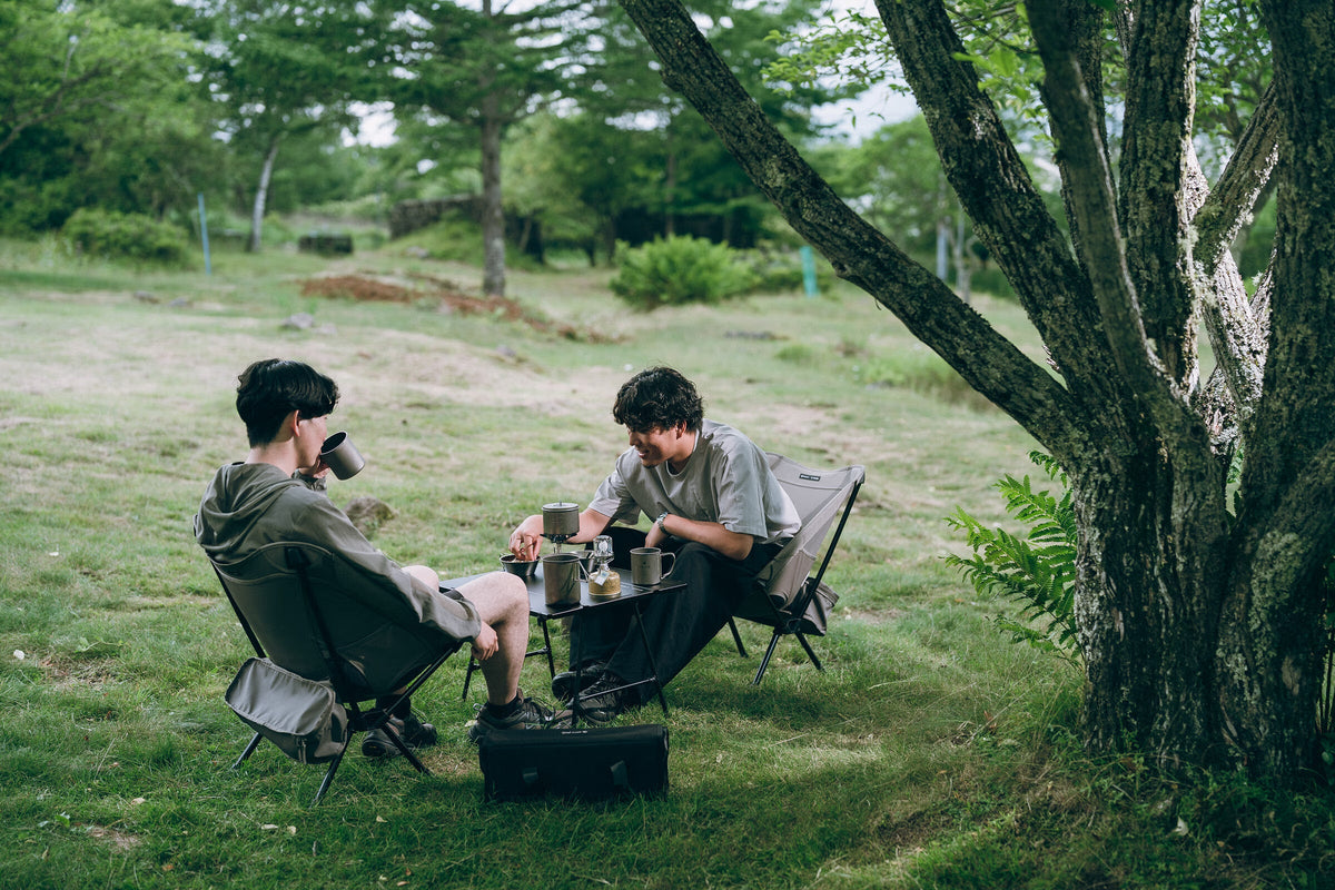 Noga Chair, Greige, two chairs at a lakeside campsite