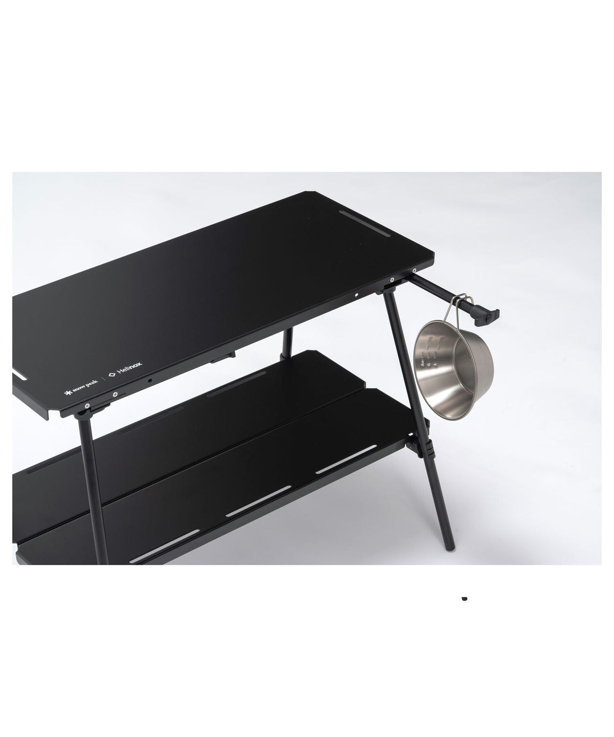 Noga Table, Black, the perimeter hanging slits in use