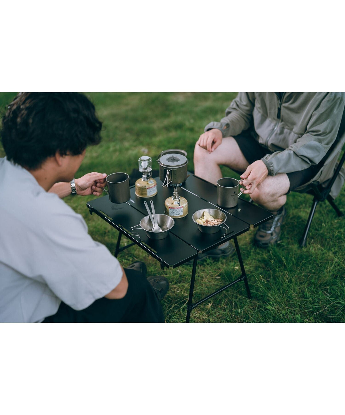 Noga Table, Black, set with coffee and cookware at camp