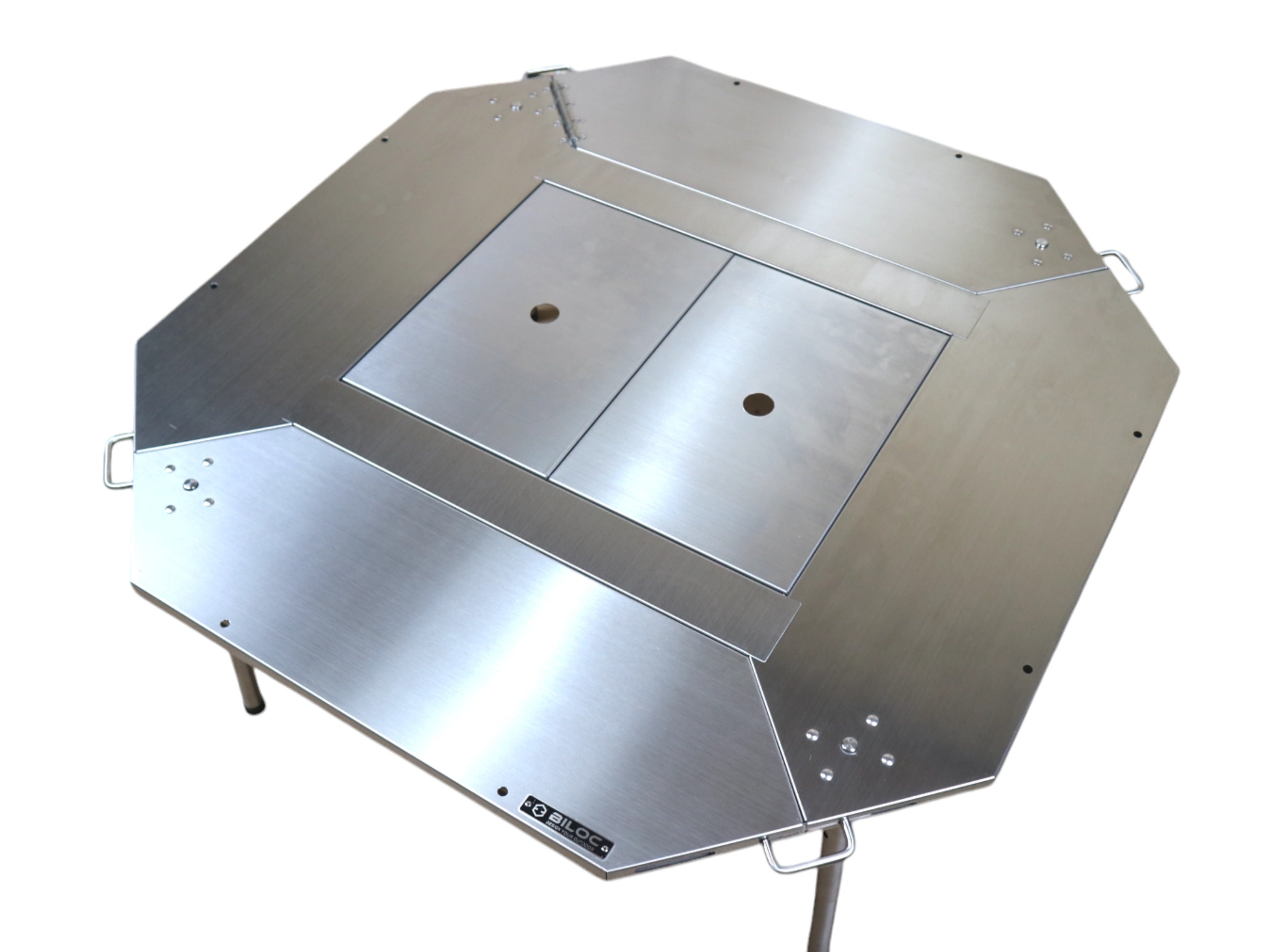 The same octagonal table with the centre bay capped by two Biloc IGT table top plates, each with a centre finger hole, giving one flat surface.