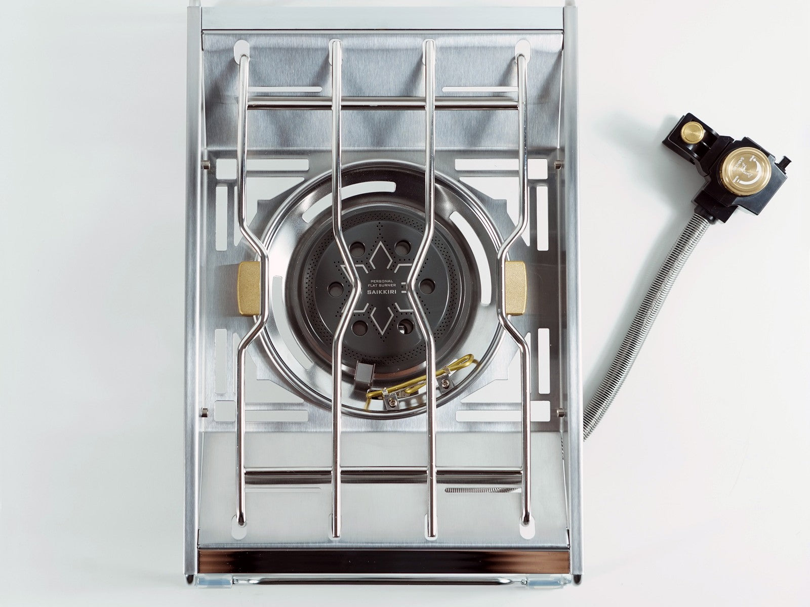 Personal Flat Burner with the brass regulator and braided hose detached alongside the burner