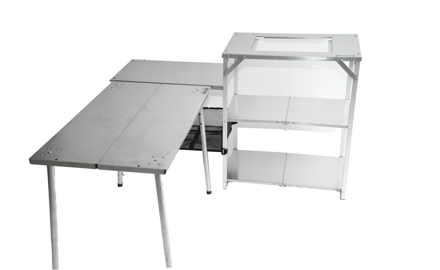 The Stella docked against a long table, seen from the opposite side with all three tiers in profile.