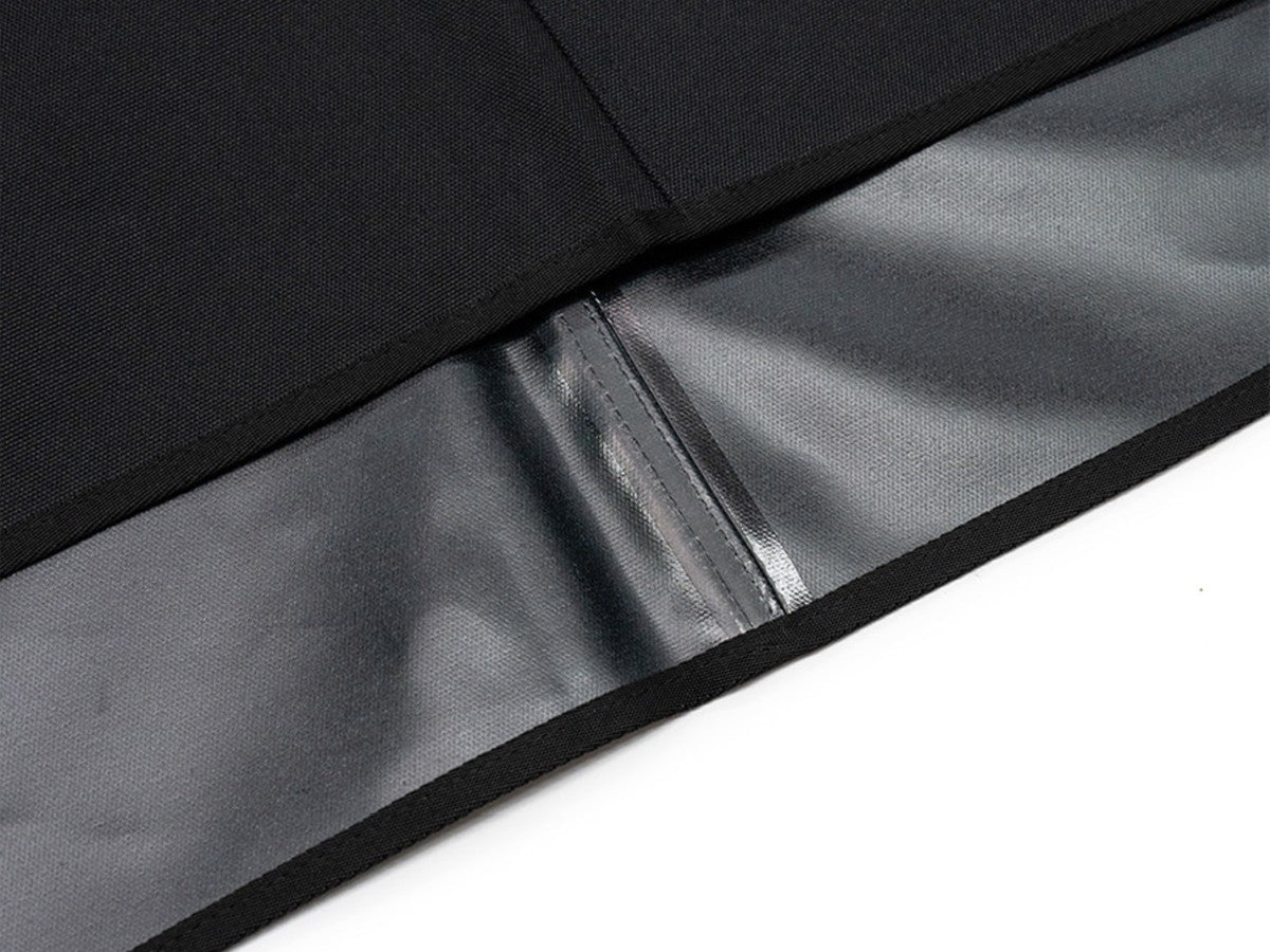 Black sheet folded back to show the silver coated underside and the sealed centre seam