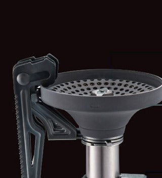 Close-up of the piezo ignition case mounted on the V1 Stove body