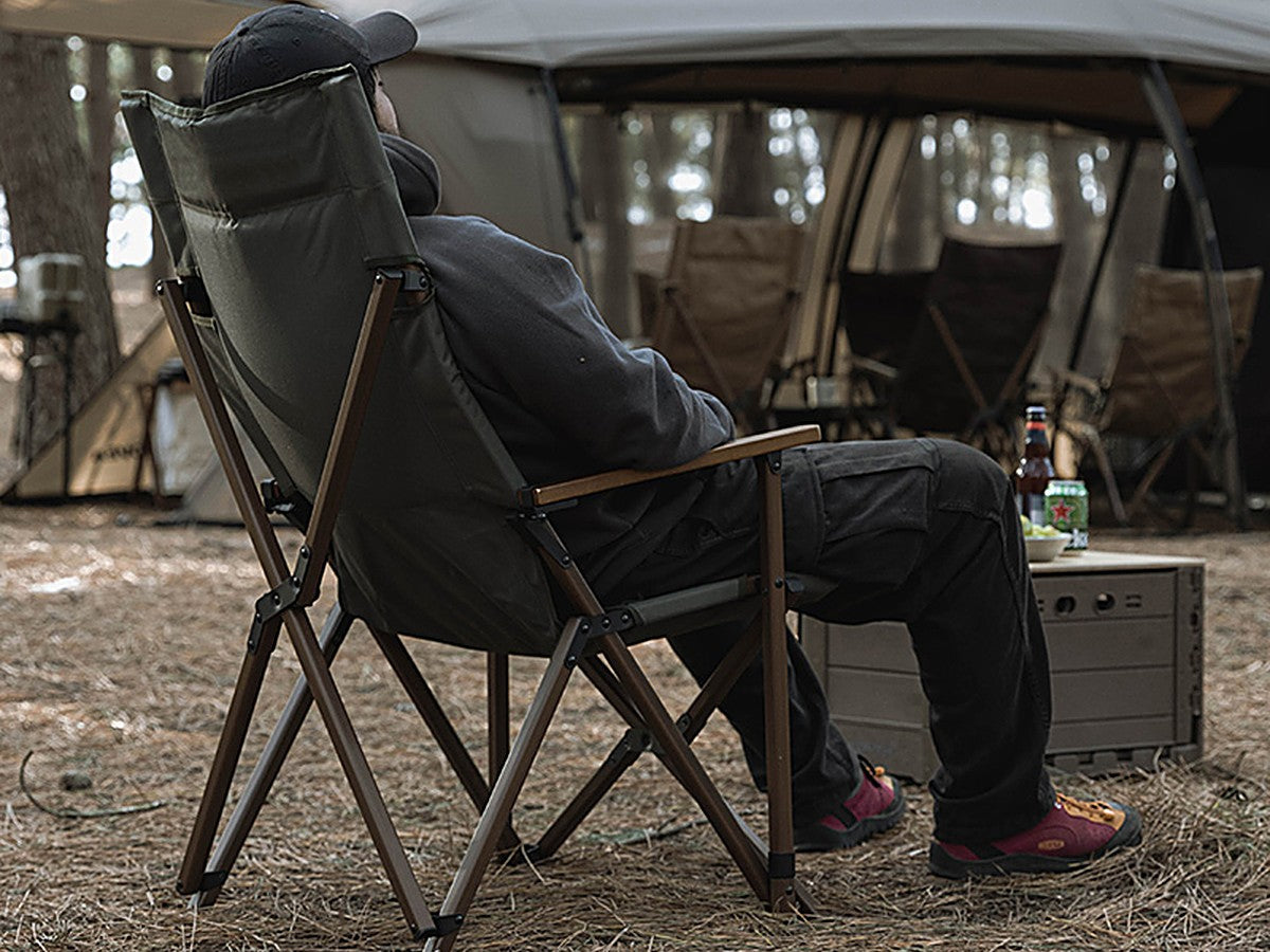Person leaning back in the WS Relax Chair Plus at a campsite